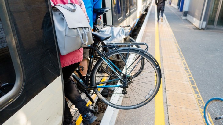 Passenger-Taking-Bike-On-Train